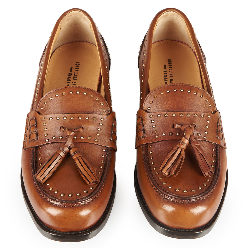 Mocassino penny con borchie e nappe