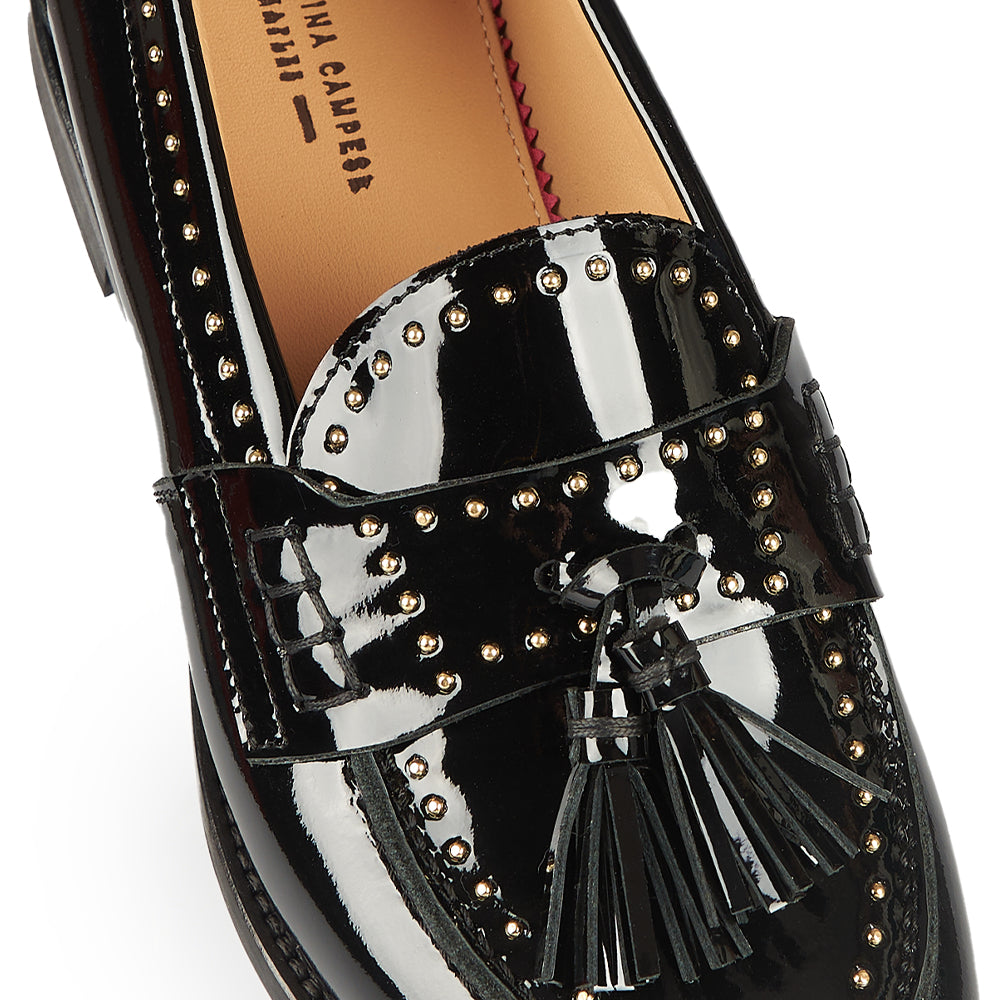 Black patent penny loafer with studs