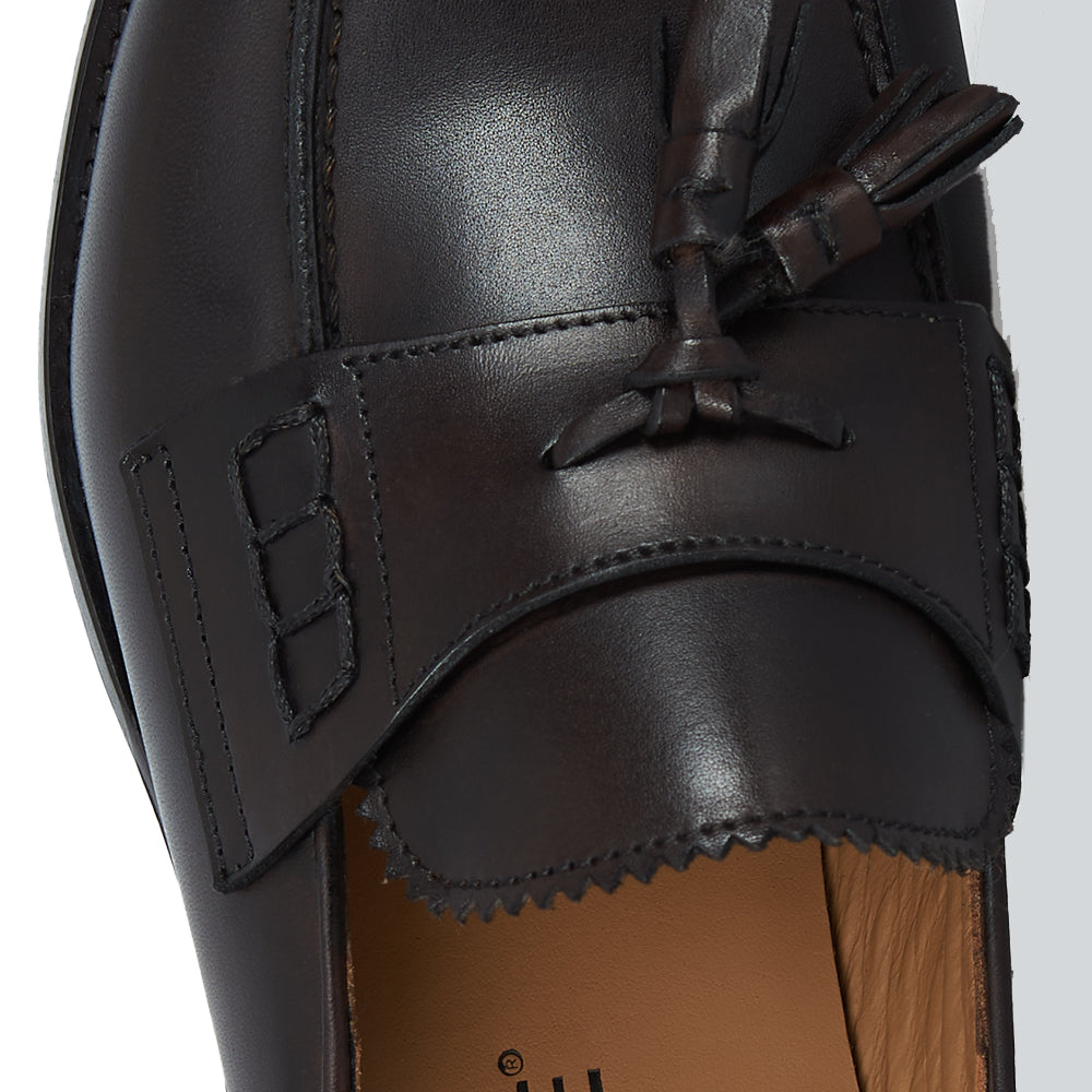 Slingback testa di moro con nappine