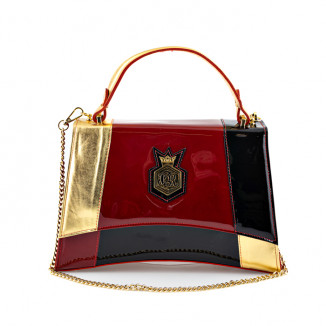 Handbag in golden leather blends with the red and black paint