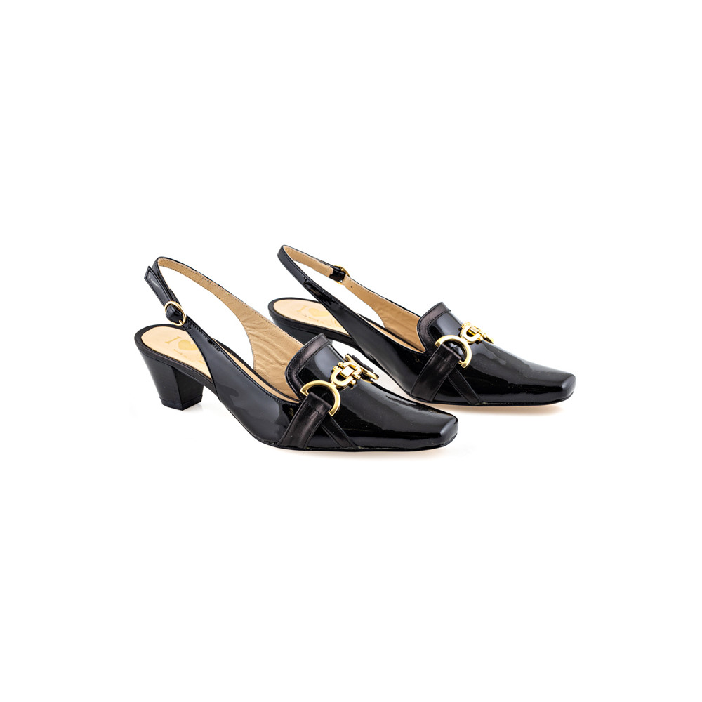Mules in strap with golden buckle in smooth black patent leather